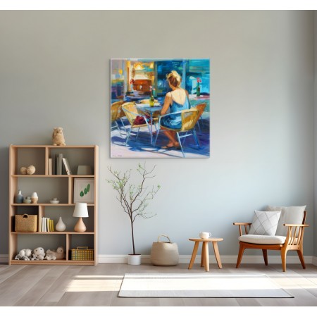 Peinture d'une femme assise sur terrasse de café  bleue et jaune par l'artiste peintre Monica Castanys dans un intérieur