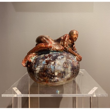 Woman lying on her side over a vase by Maurizio Mastromatteo