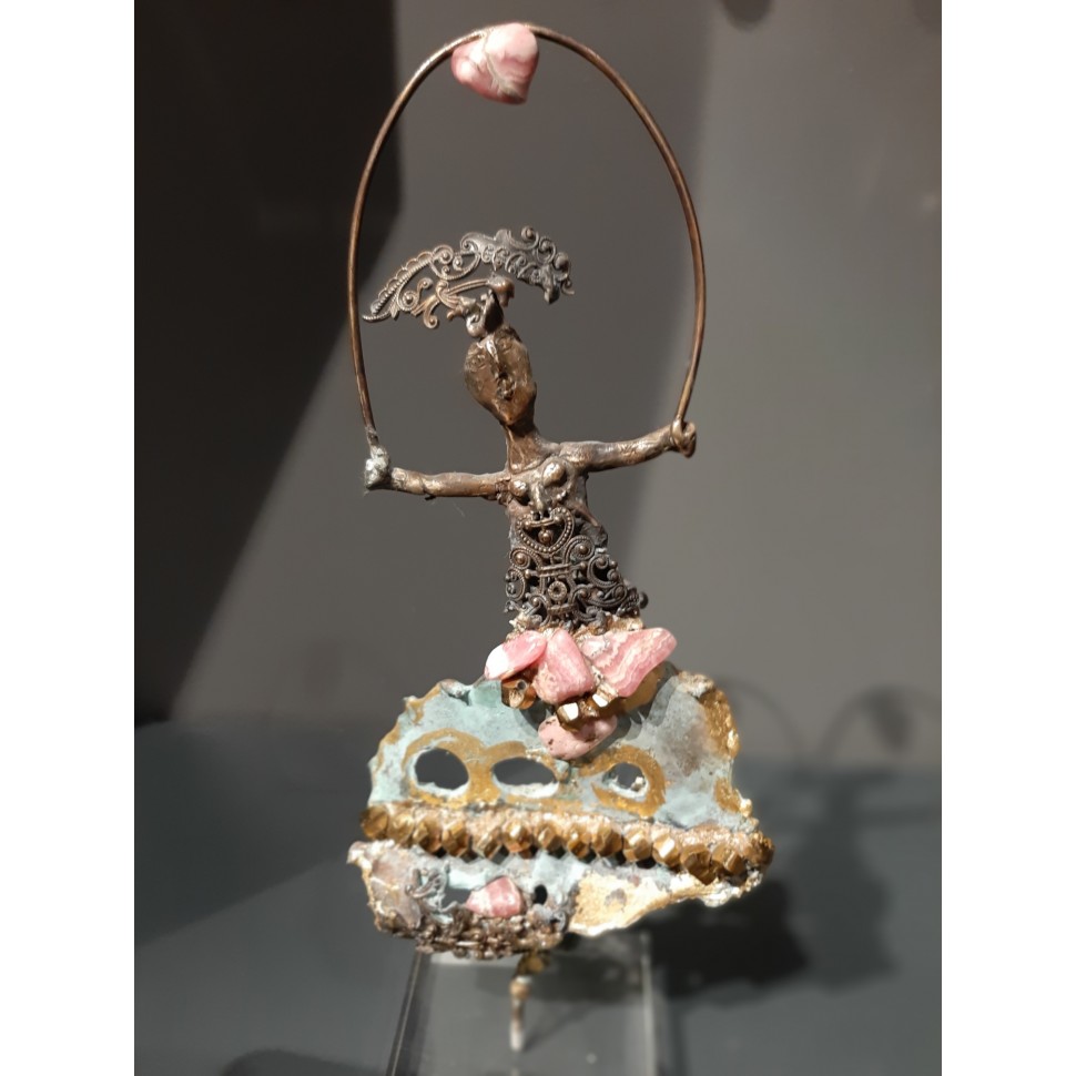 Bronze sculpture with gold leaf and semi-precious stones of a woman playing with a jewel, by sculptor artist Élisabeth Brainos