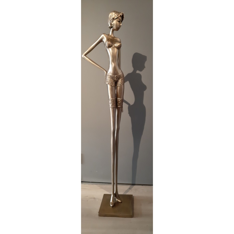 Bronze sculpture of an elegant and elongated woman in fine lingerie signed Chantal de Sutter